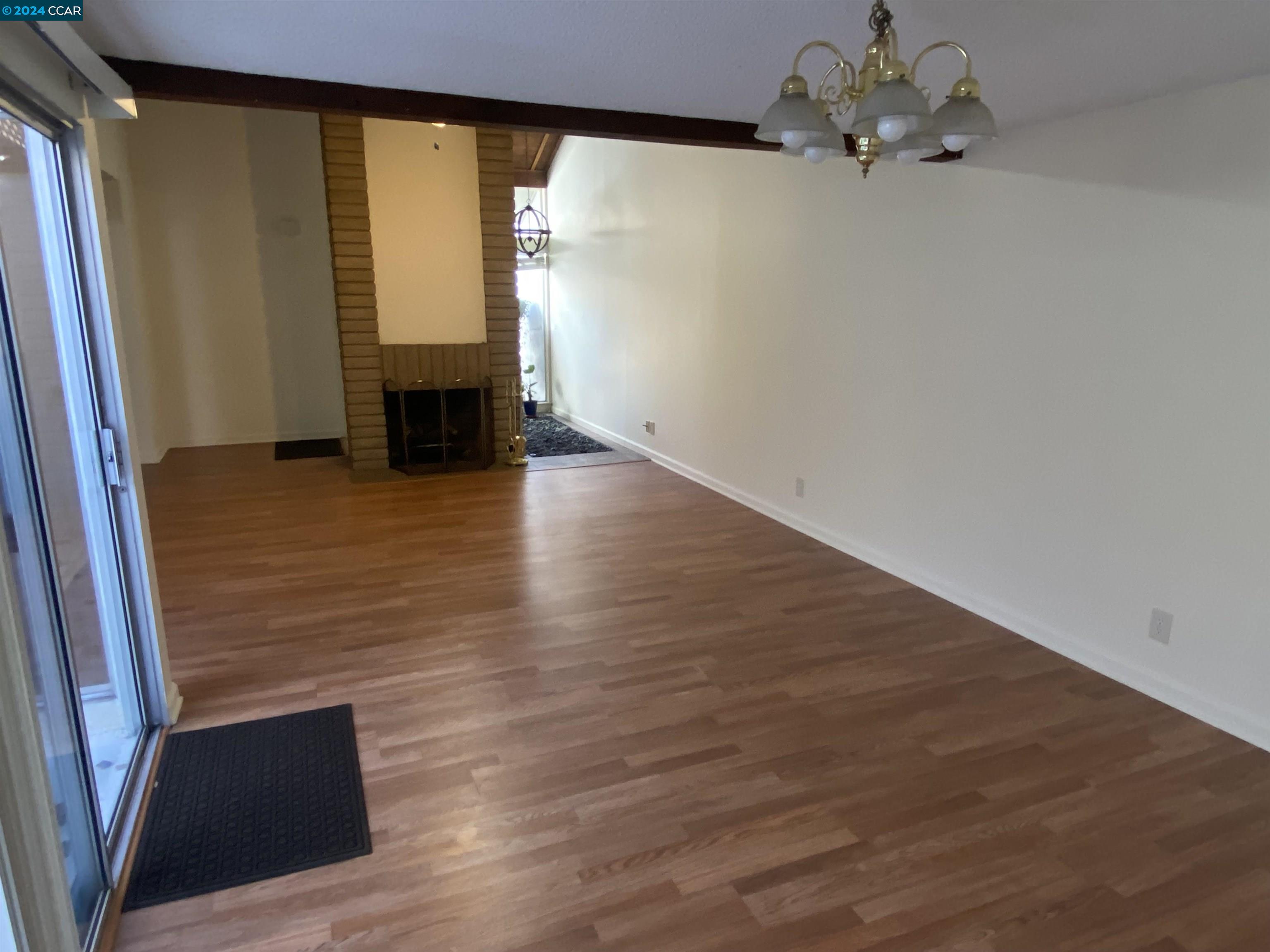 506 Tampico Walnut Creek, CA 94598 - Photo 6 of 32 wooden floor in an empty room with a window