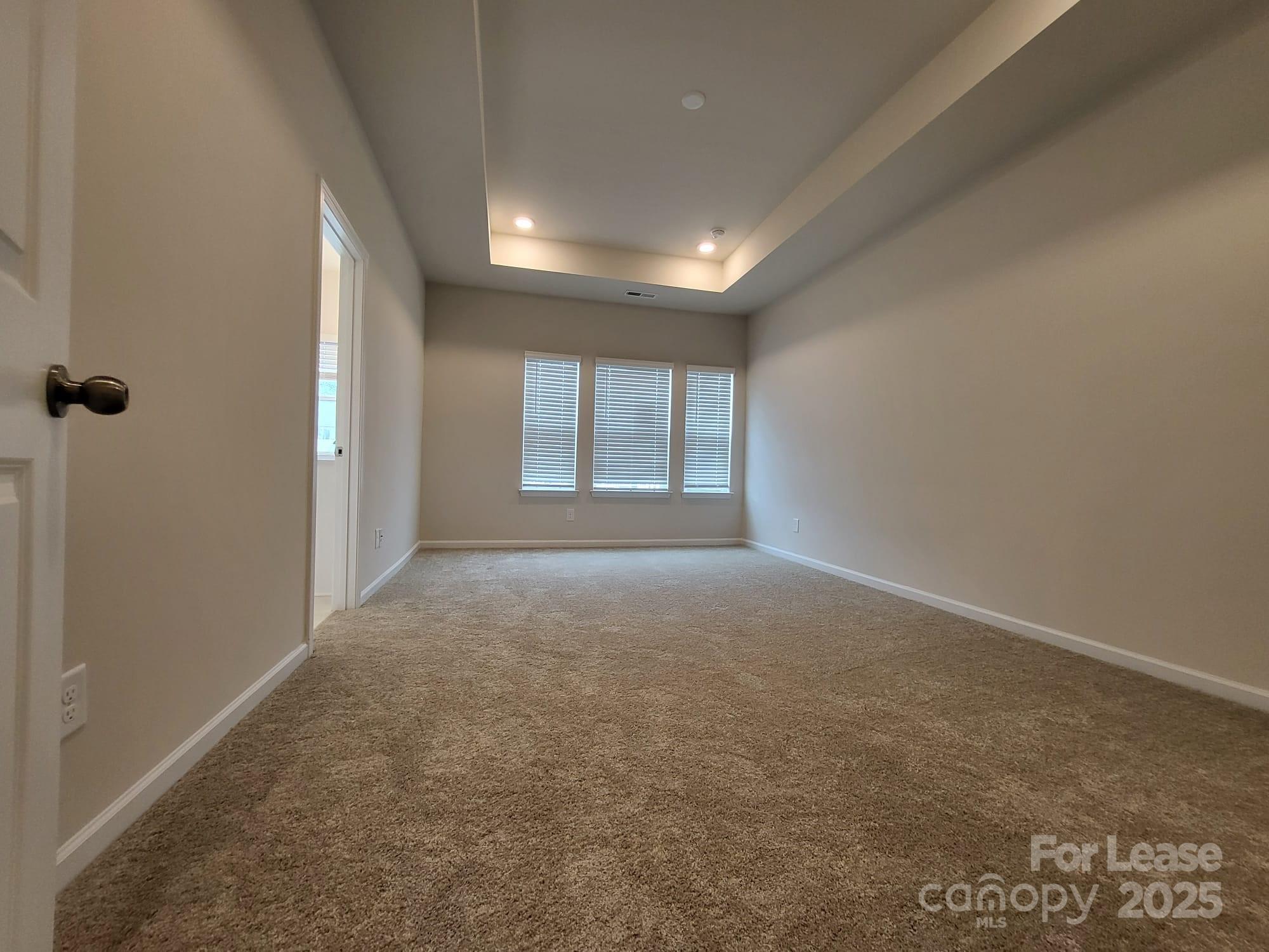 3511 Glenn Hope Way Matthews, NC 28104 - Photo 11 of 17 an empty room with windows