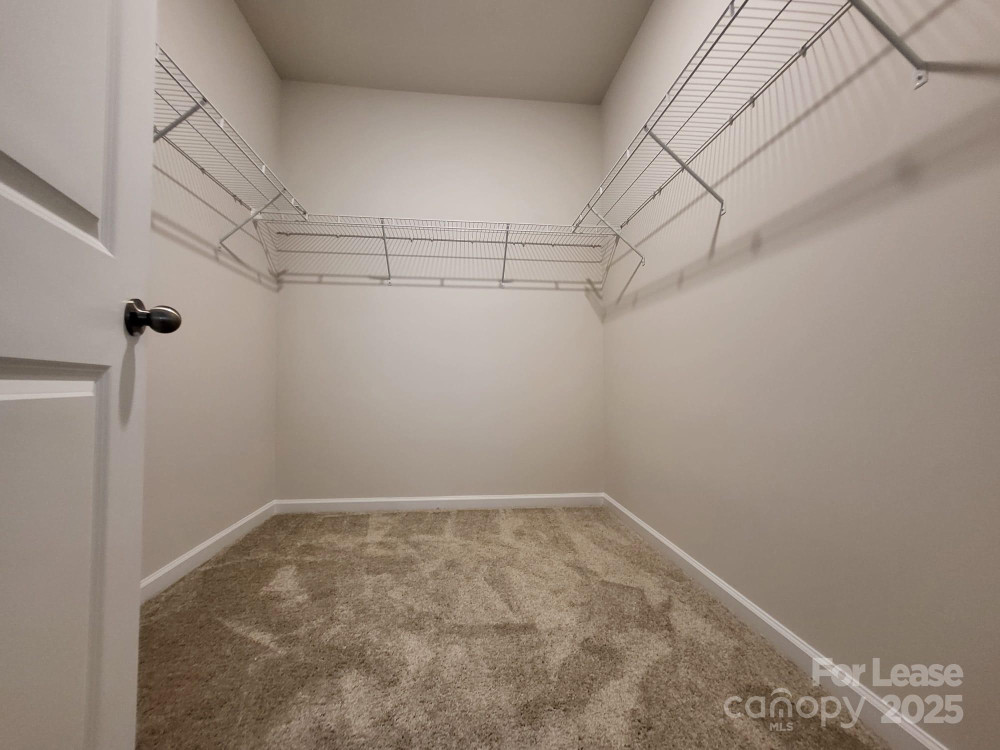 3511 Glenn Hope Way Matthews, NC 28104 - Photo 12 of 17 a view of a room with racks on the wall