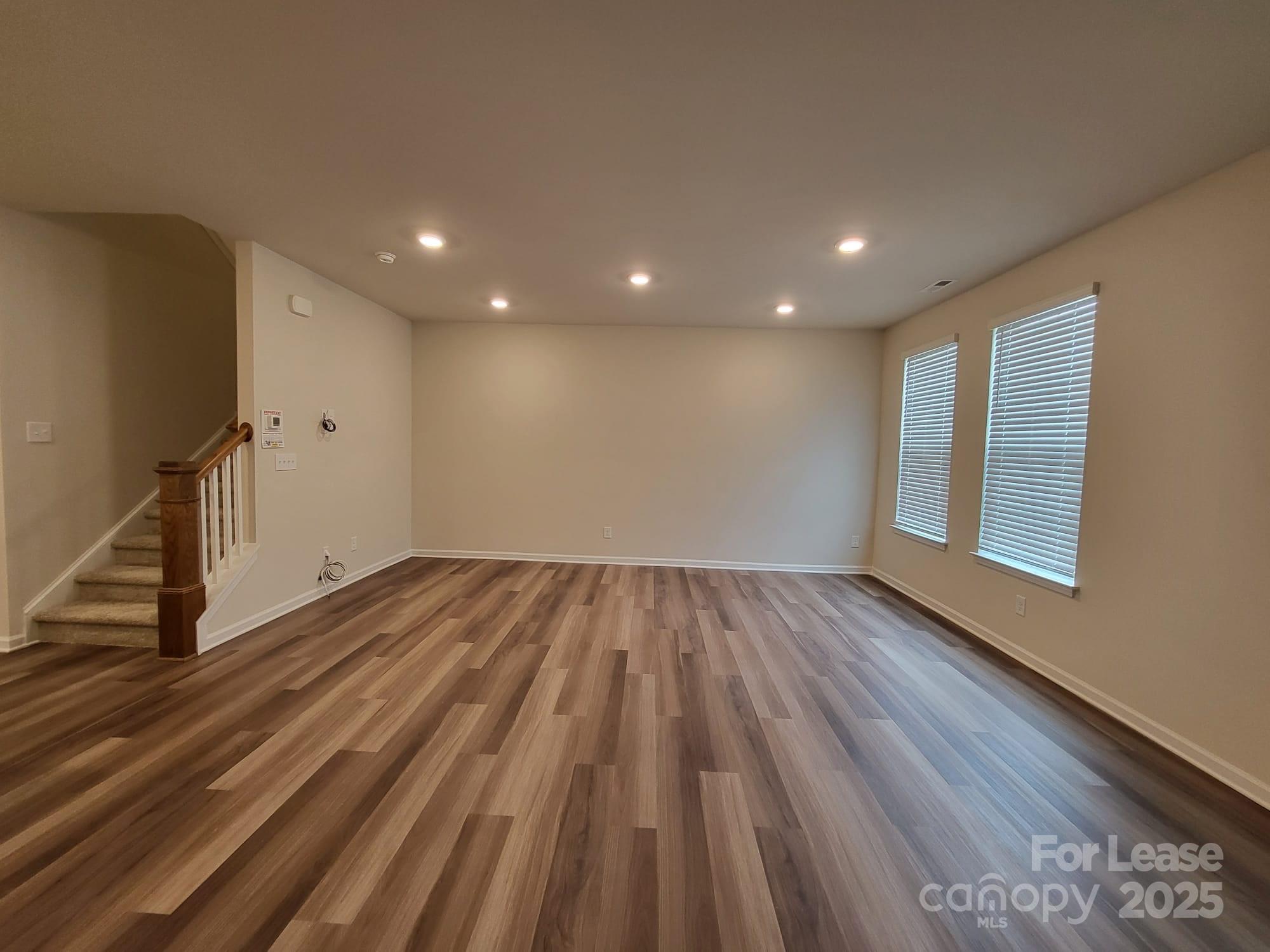 3511 Glenn Hope Way Matthews, NC 28104 - Photo 7 of 17 a view of empty room with wooden floor and fan