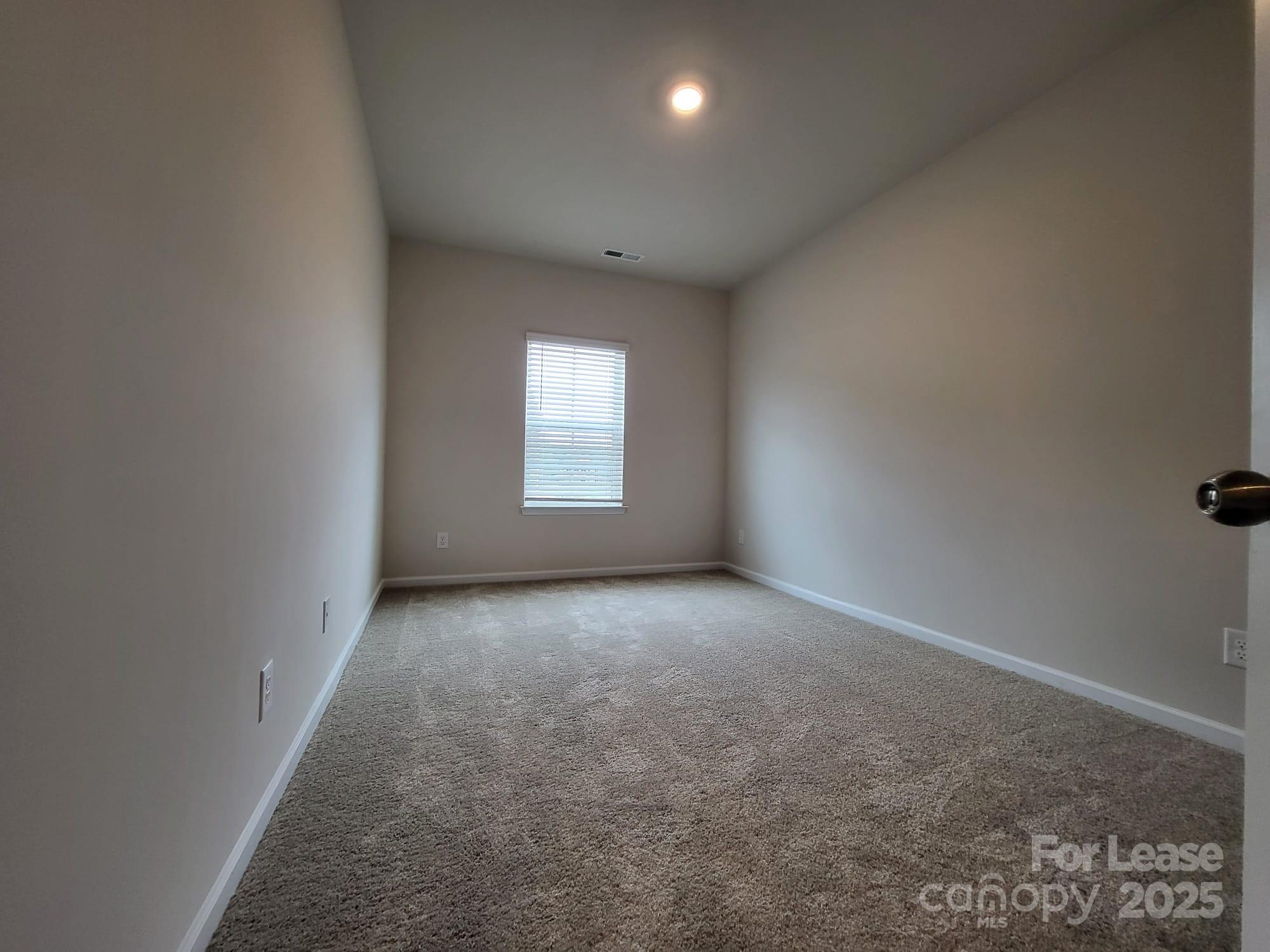 3511 Glenn Hope Way Matthews, NC 28104 - Photo 9 of 17 an empty room with windows