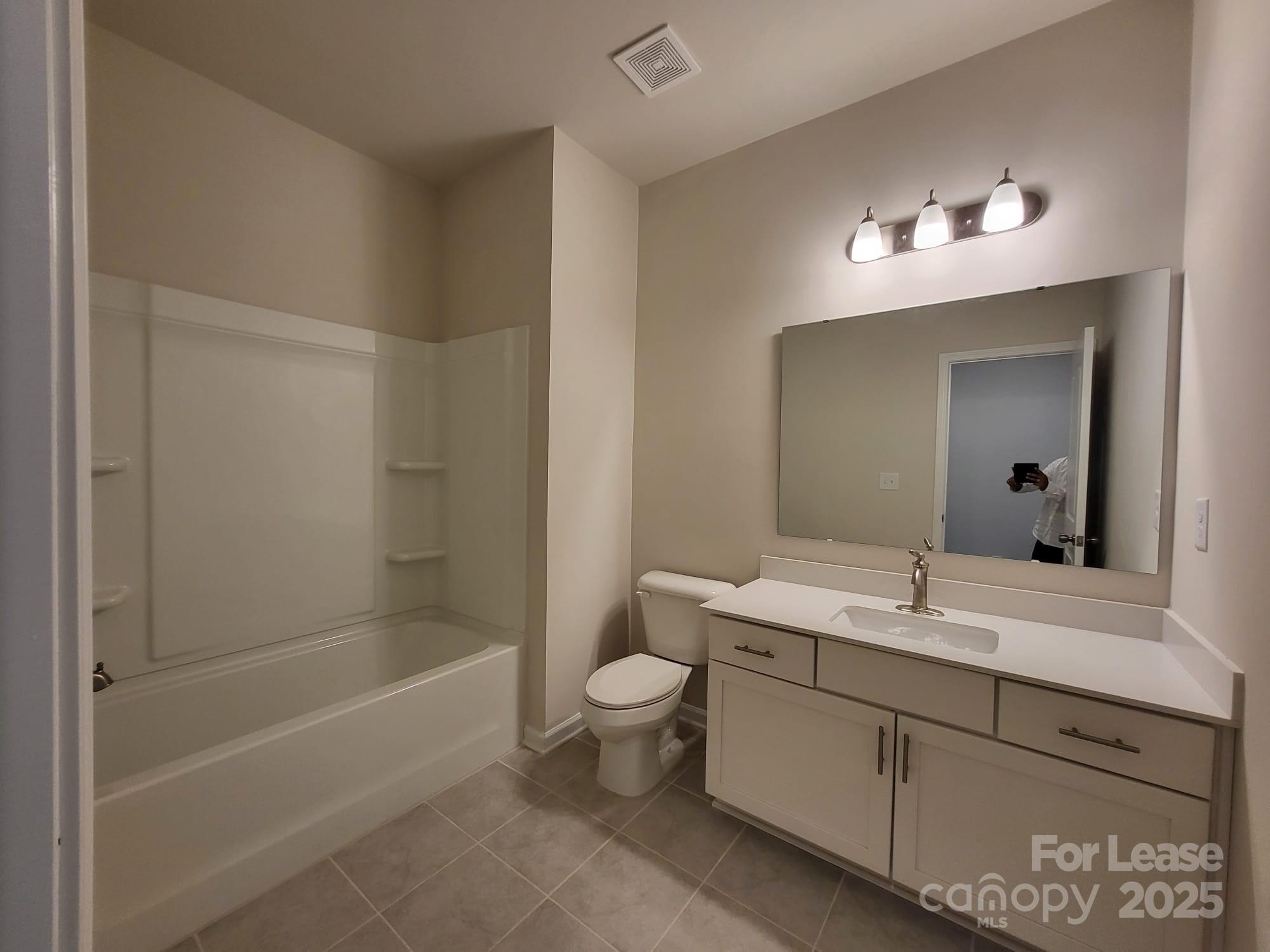 3511 Glenn Hope Way Matthews, NC 28104 - Photo 10 of 17 a bathroom with a tub sink mirror and toilet