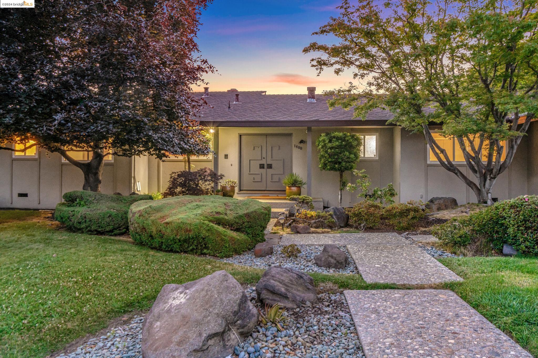 a view of a house with a garden