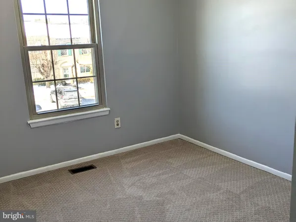 a bathroom with a toilet and a bath tub