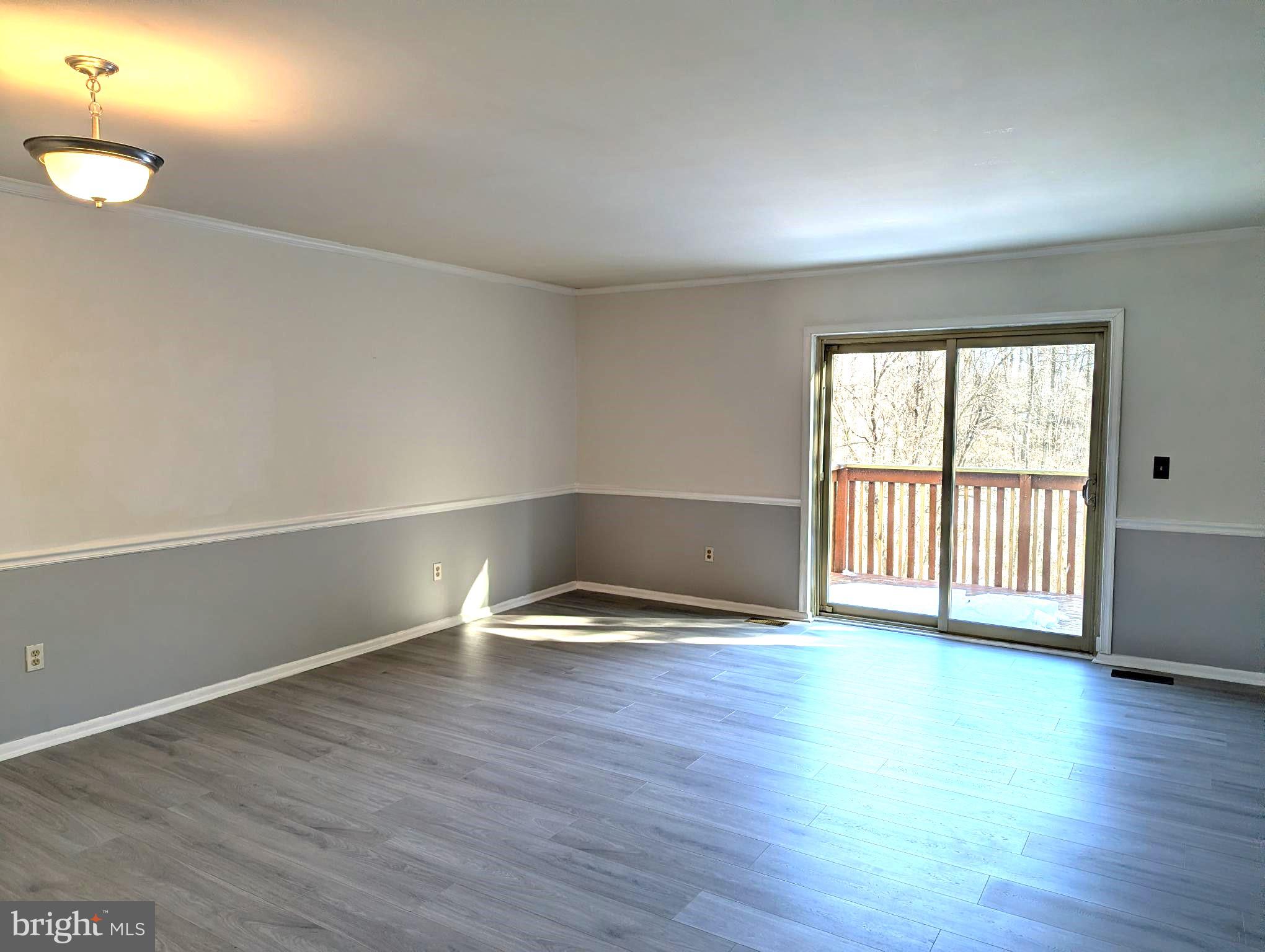 22 Bryce Court Baltimore, MD 21236 - Photo 3 of 23 Living room/sliders to deck