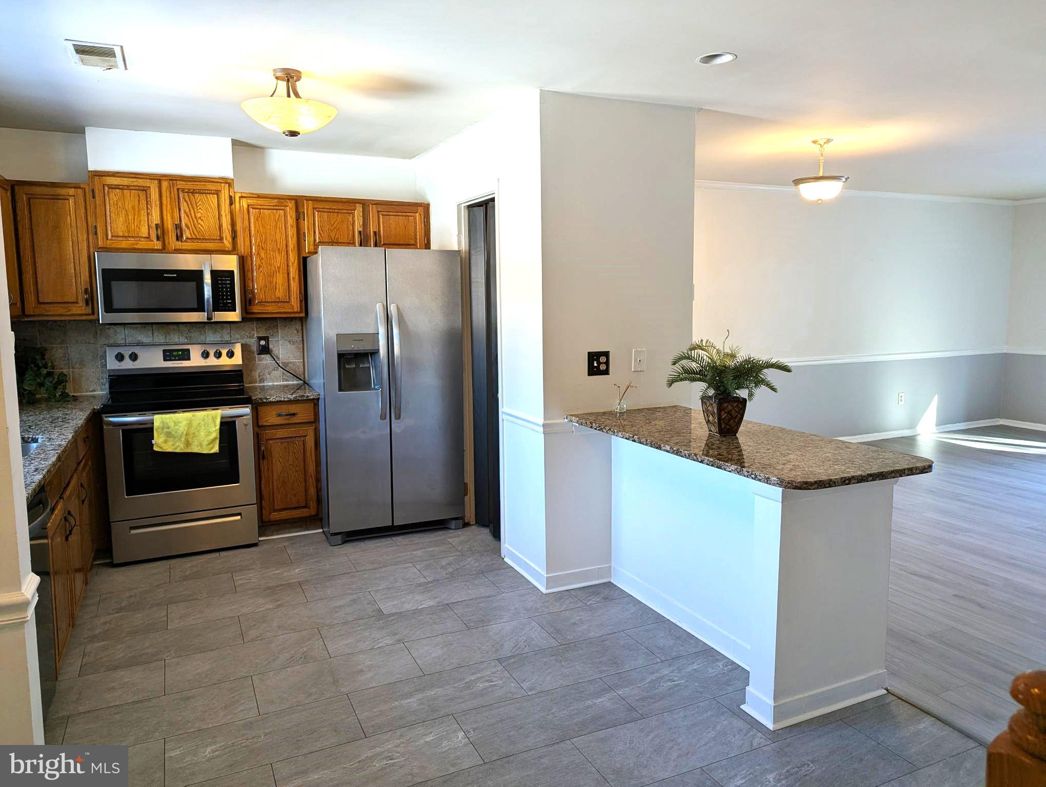 22 Bryce Court Baltimore, MD 21236 - Photo 8 of 23 Kitchen open to living room