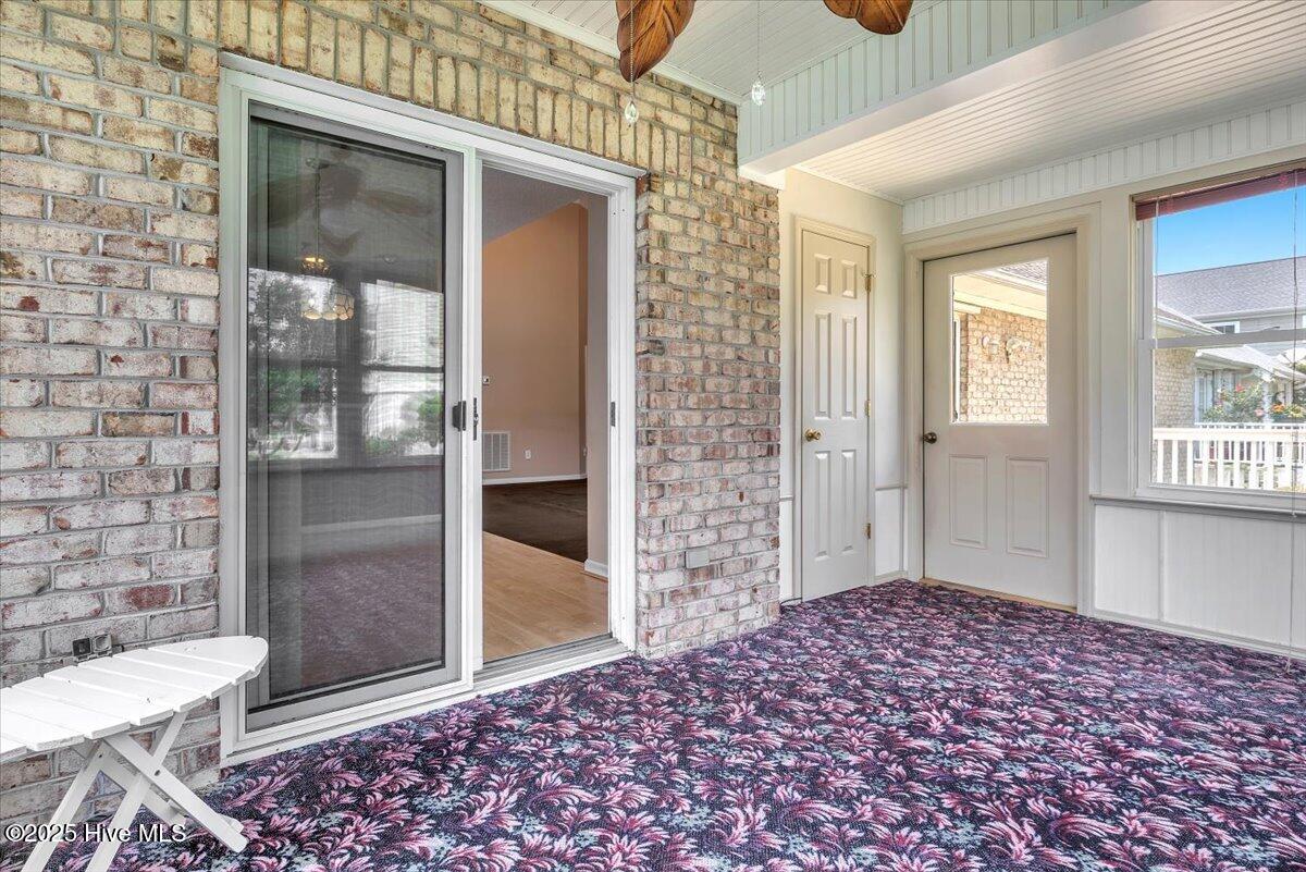 734 Sloop Pointe Lane Kure Beach, NC 28449 - Photo 27 of 54 Glassed in Rear Porch