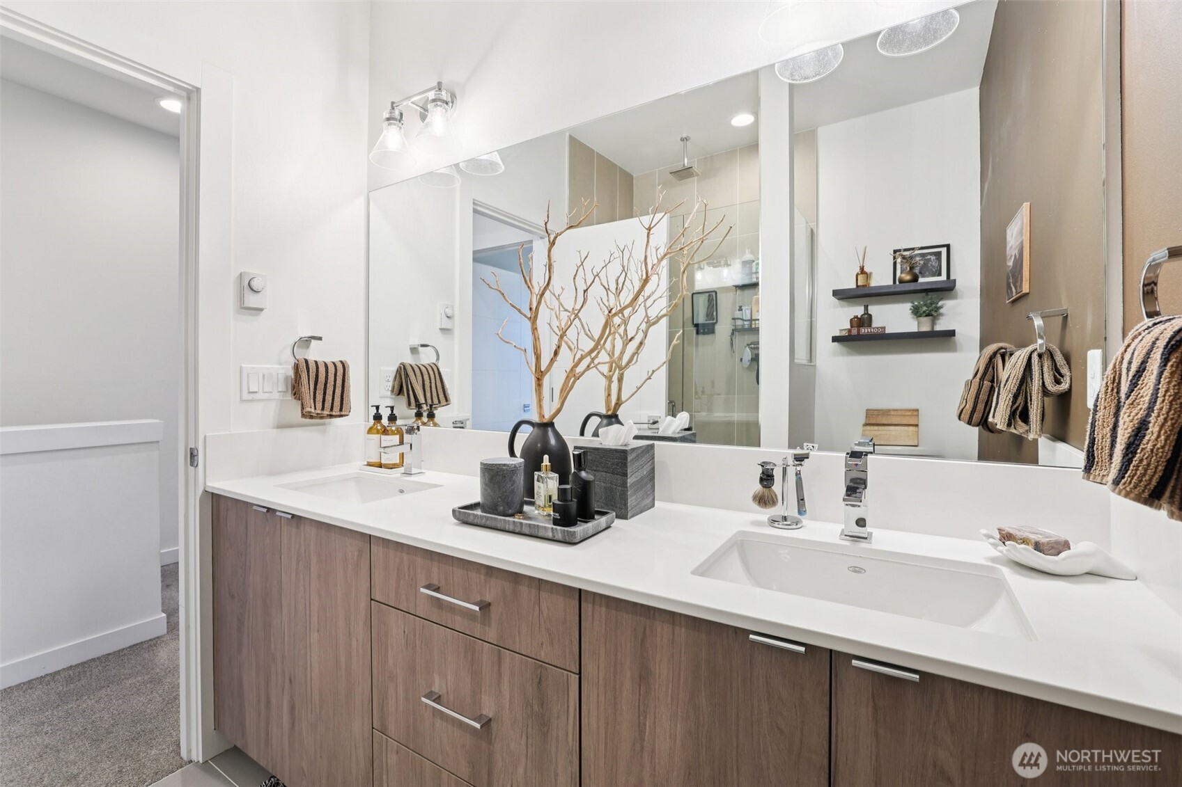 2403 Southwest Edmunds Street Seattle, WA 98106 - Photo 14 of 25 a bathroom with double vanity sinks and a mirror