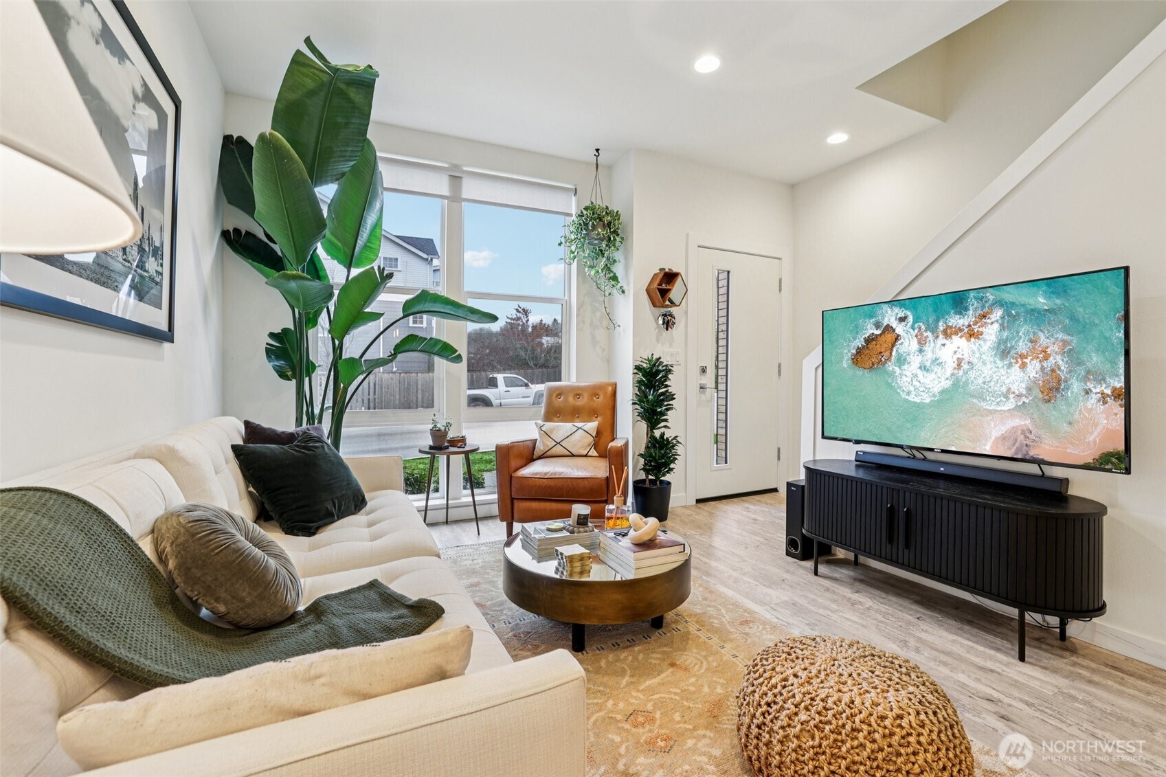2403 Southwest Edmunds Street Seattle, WA 98106 - Photo 3 of 25 a living room with furniture and a flat screen tv