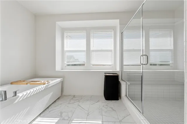 a bathroom with a bathtub and a table