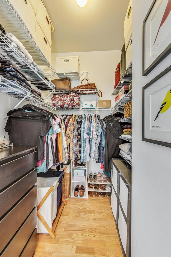4150 North Sheridan Road, Unit 2S Chicago, IL 60613 - Photo 18 of 29 a view of walk in closet with clothes and shoes