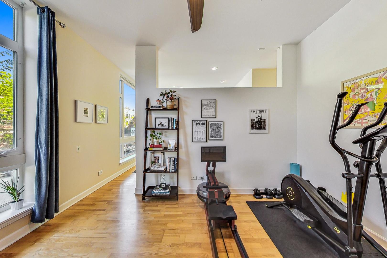 4150 North Sheridan Road, Unit 2S Chicago, IL 60613 - Photo 25 of 29 a view of a workspace with furniture and gym equipment