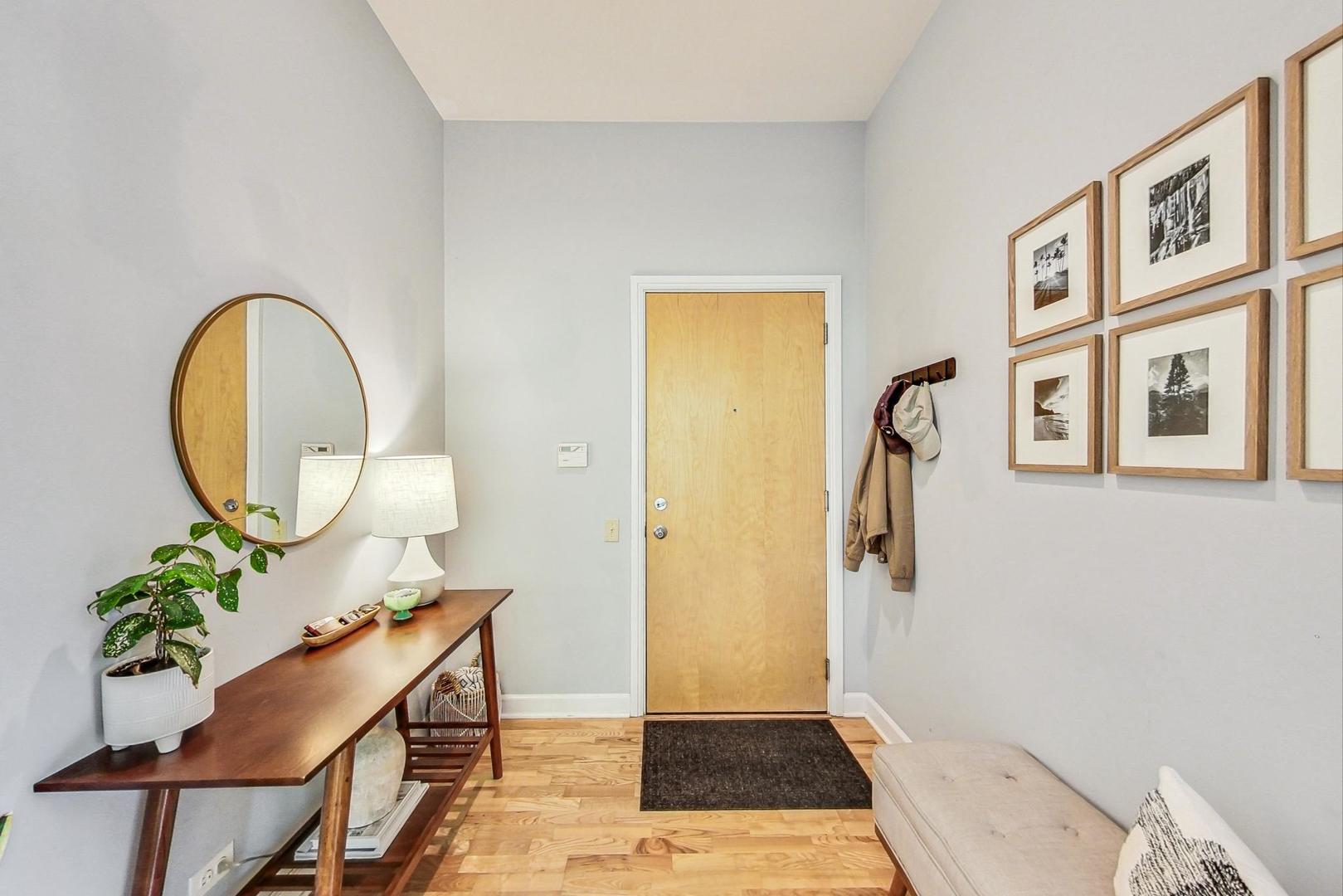 4150 North Sheridan Road, Unit 2S Chicago, IL 60613 - Photo 4 of 29 a view of an entryway with wooden floor