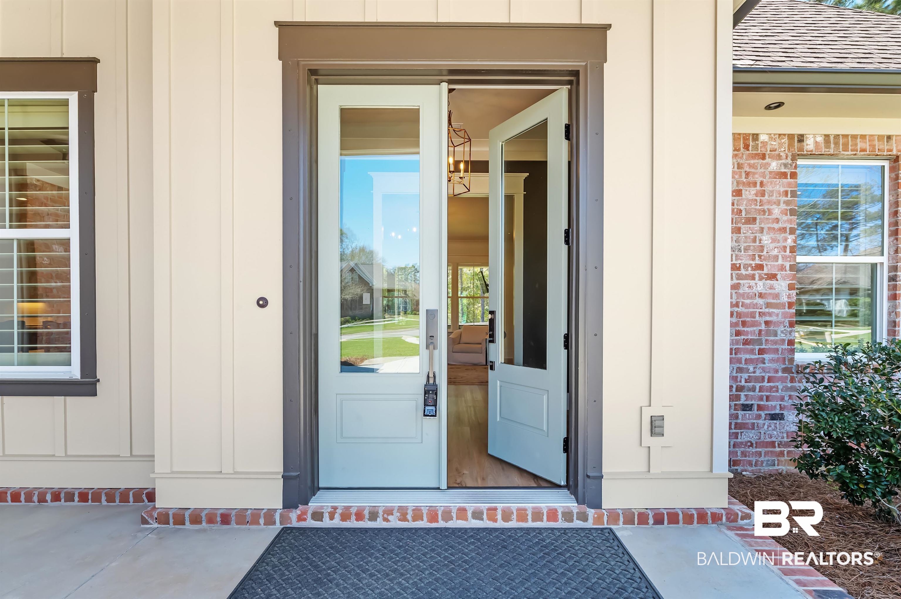 27888 Oakachoy Loop Daphne, AL 36526 - Photo 2 of 65 Doorway to property featuring board and batten siding and roof with shingles