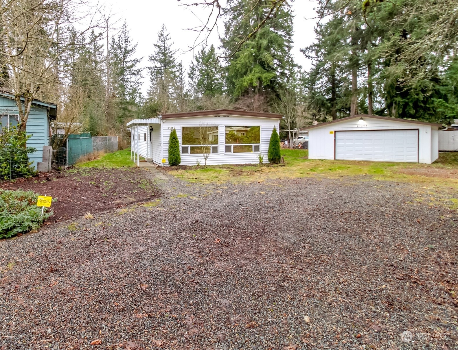 27508 220th Place Southeast Maple Valley, WA 98038 - Photo 1 of 25 a front view of a house with a yard and a garage