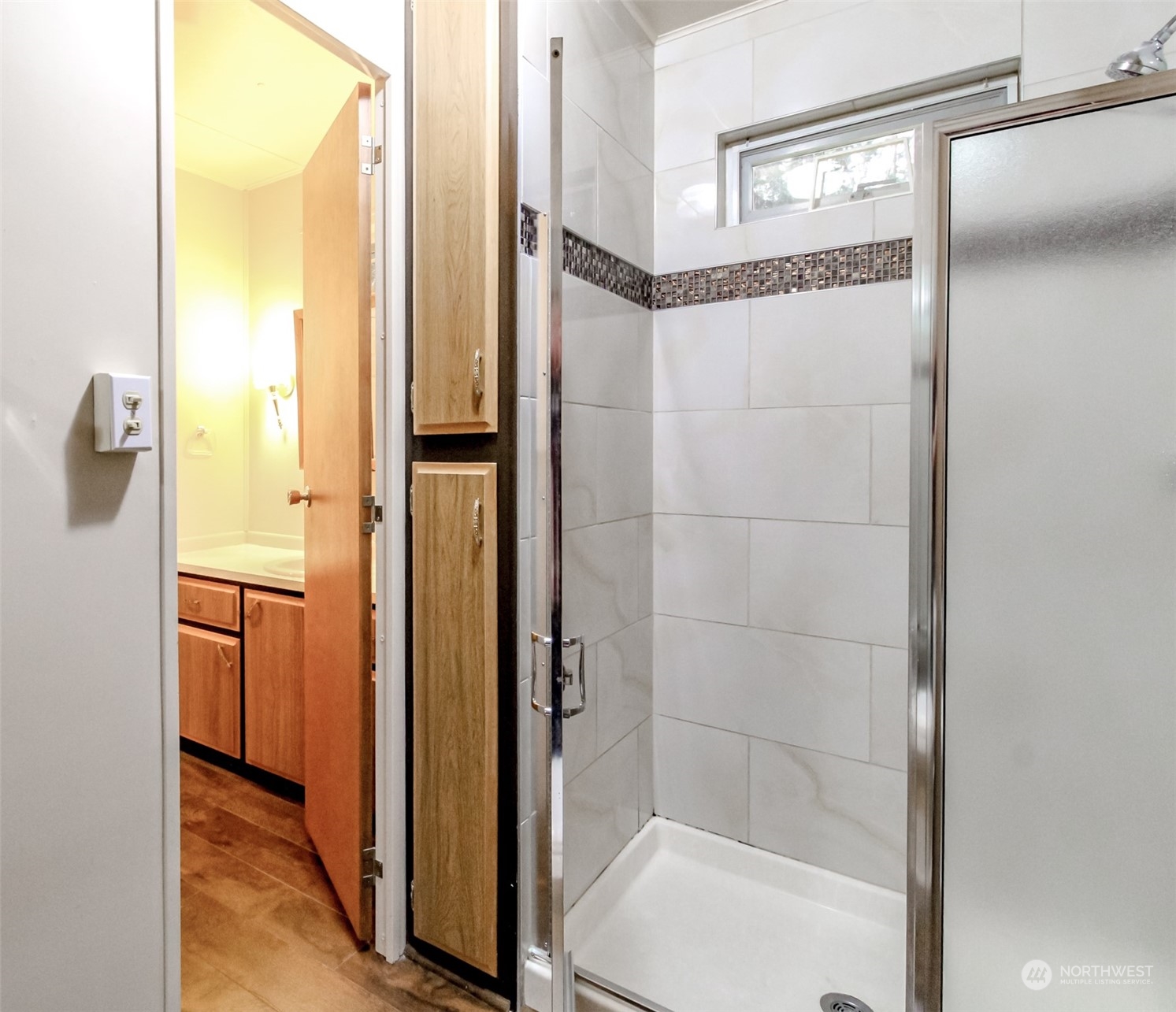 27508 220th Place Southeast Maple Valley, WA 98038 - Photo 14 of 25 a bathroom with a glass shower door