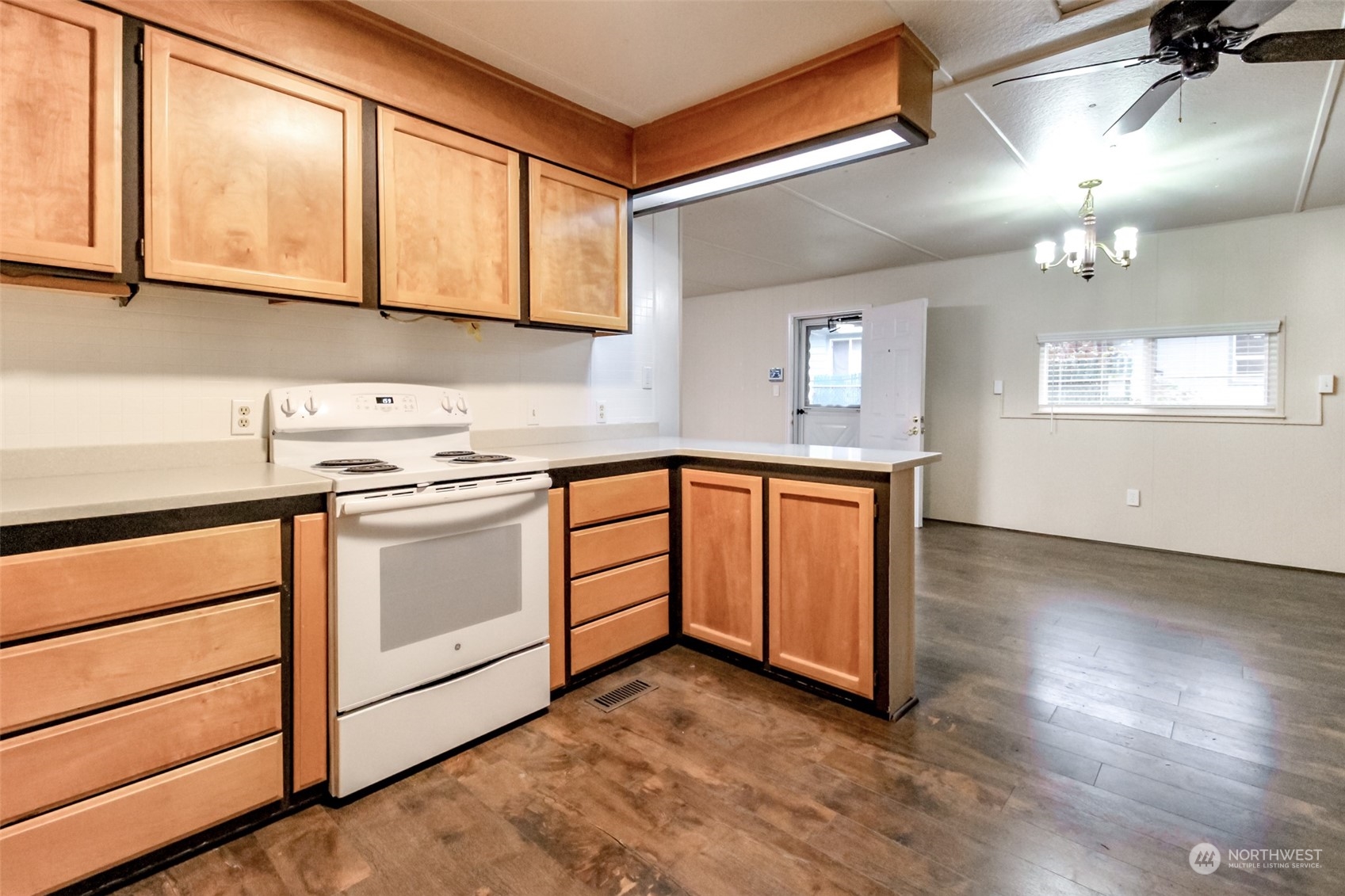 27508 220th Place Southeast Maple Valley, WA 98038 - Photo 8 of 25 a kitchen with granite countertop white cabinets and white appliances
