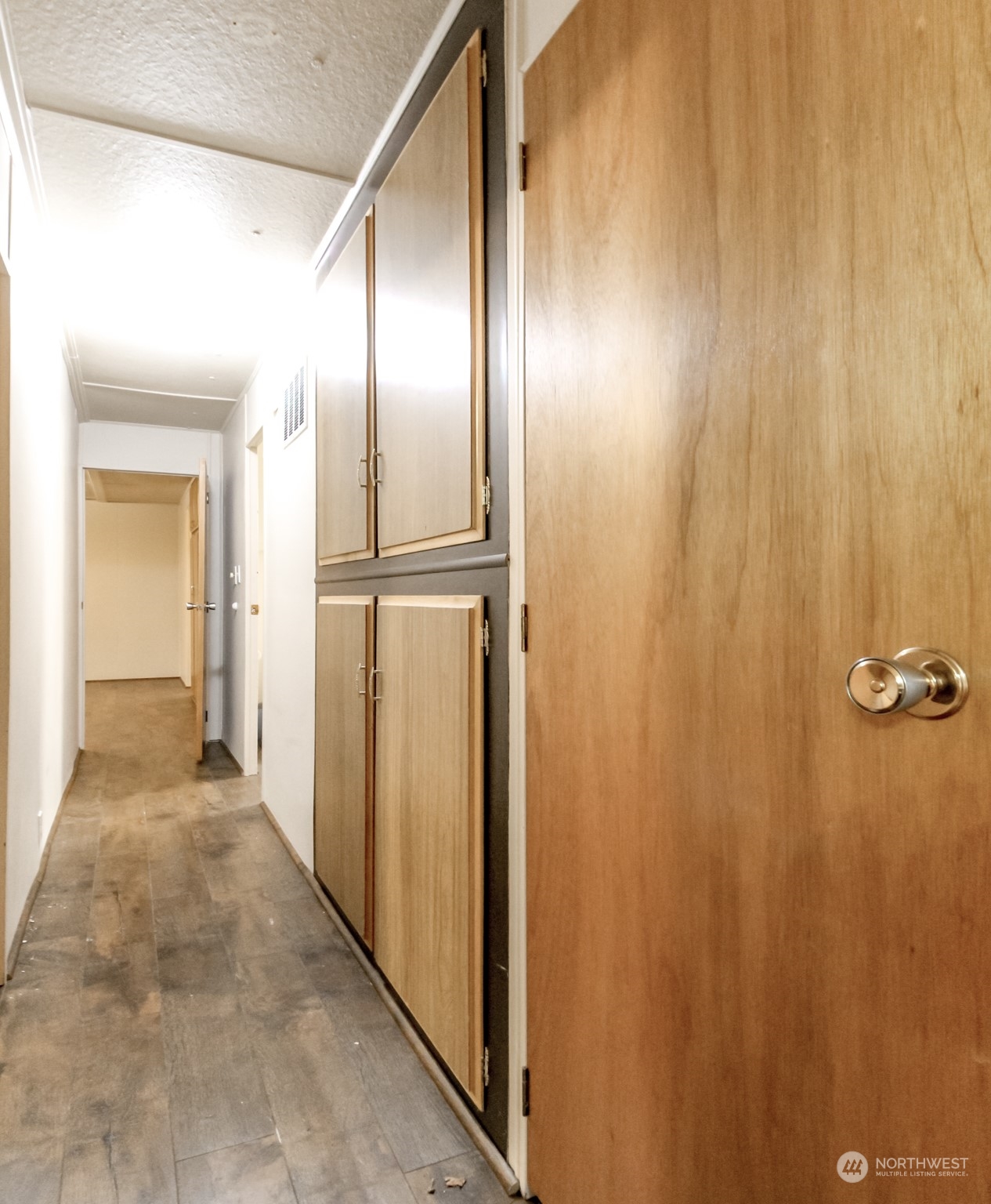 27508 220th Place Southeast Maple Valley, WA 98038 - Photo 10 of 25 a view of a hallway with wooden walls