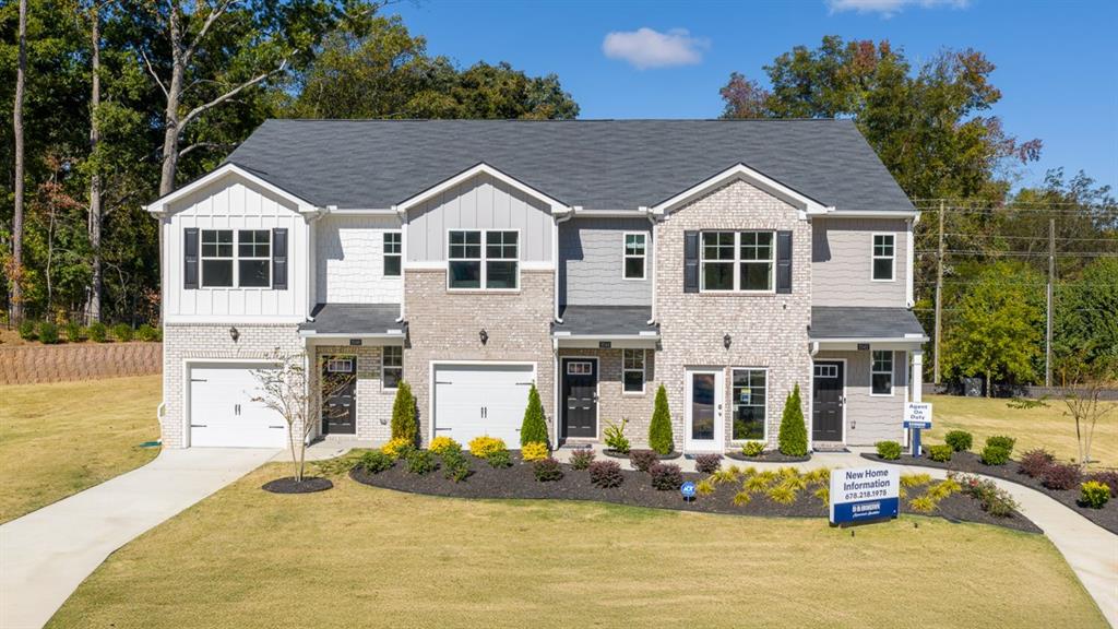 2082 Moss Hill Road Stone Mountain, GA 30083 - Photo 1 of 38 a view of a white house with a small yard and potted plants