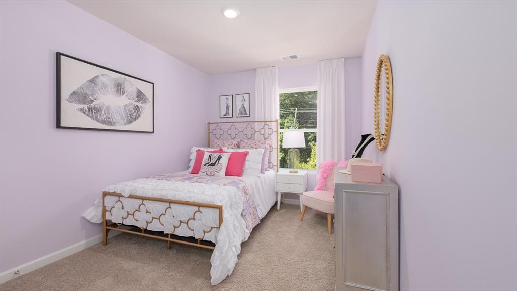 2082 Moss Hill Road Stone Mountain, GA 30083 - Photo 30 of 38 a bedroom with a bed and a painting on the wall