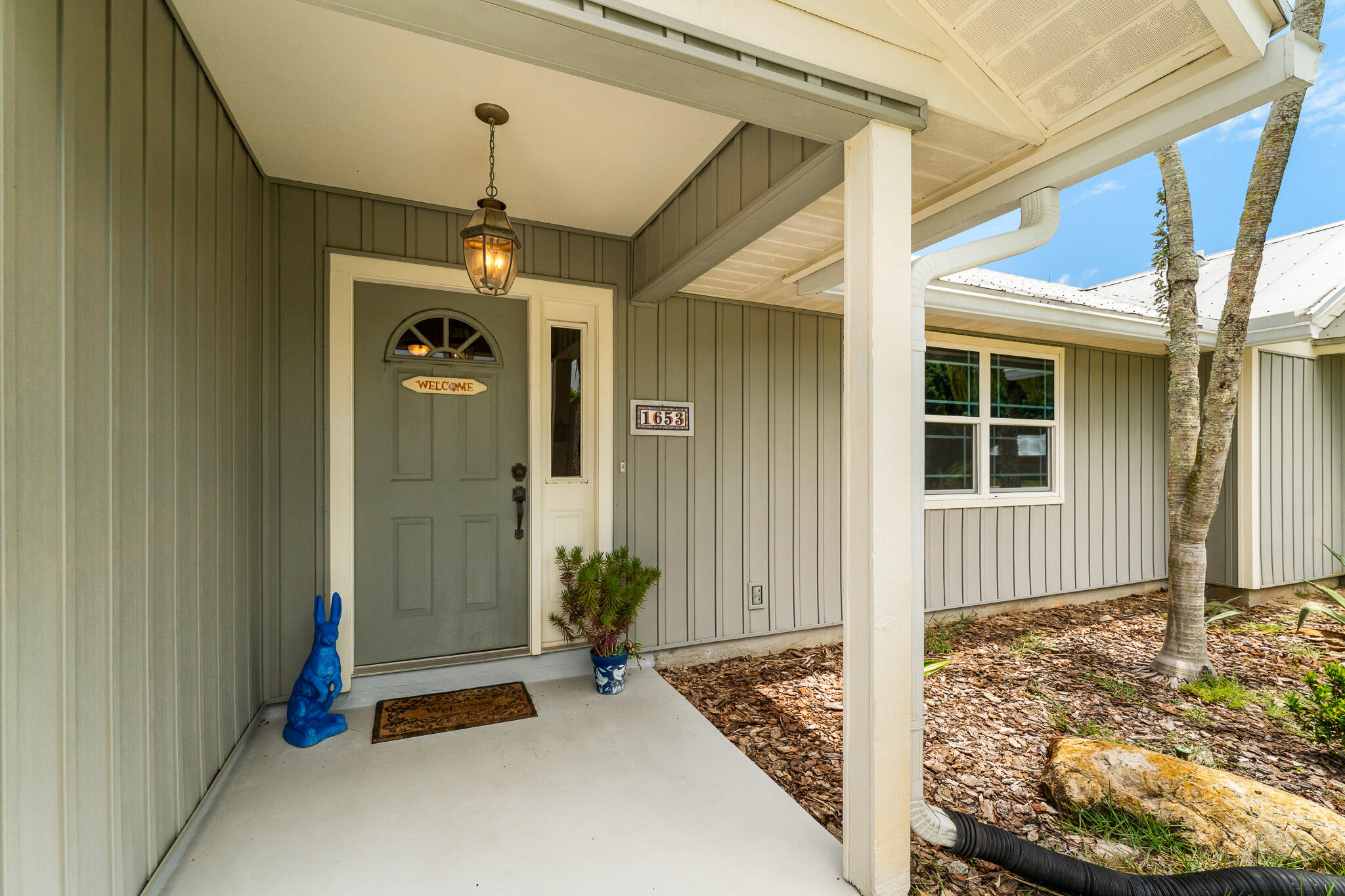 1653 Southwest 85th Terrace Stuart, FL 34997 - Photo 5 of 54 a front view of a house