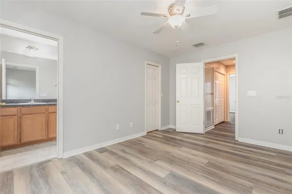 a view of a livingroom with a dishwasher cabinets and wooden floor
