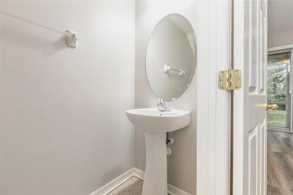 a bathroom with a sink and mirror
