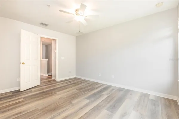 a view of a room with a ceiling fan