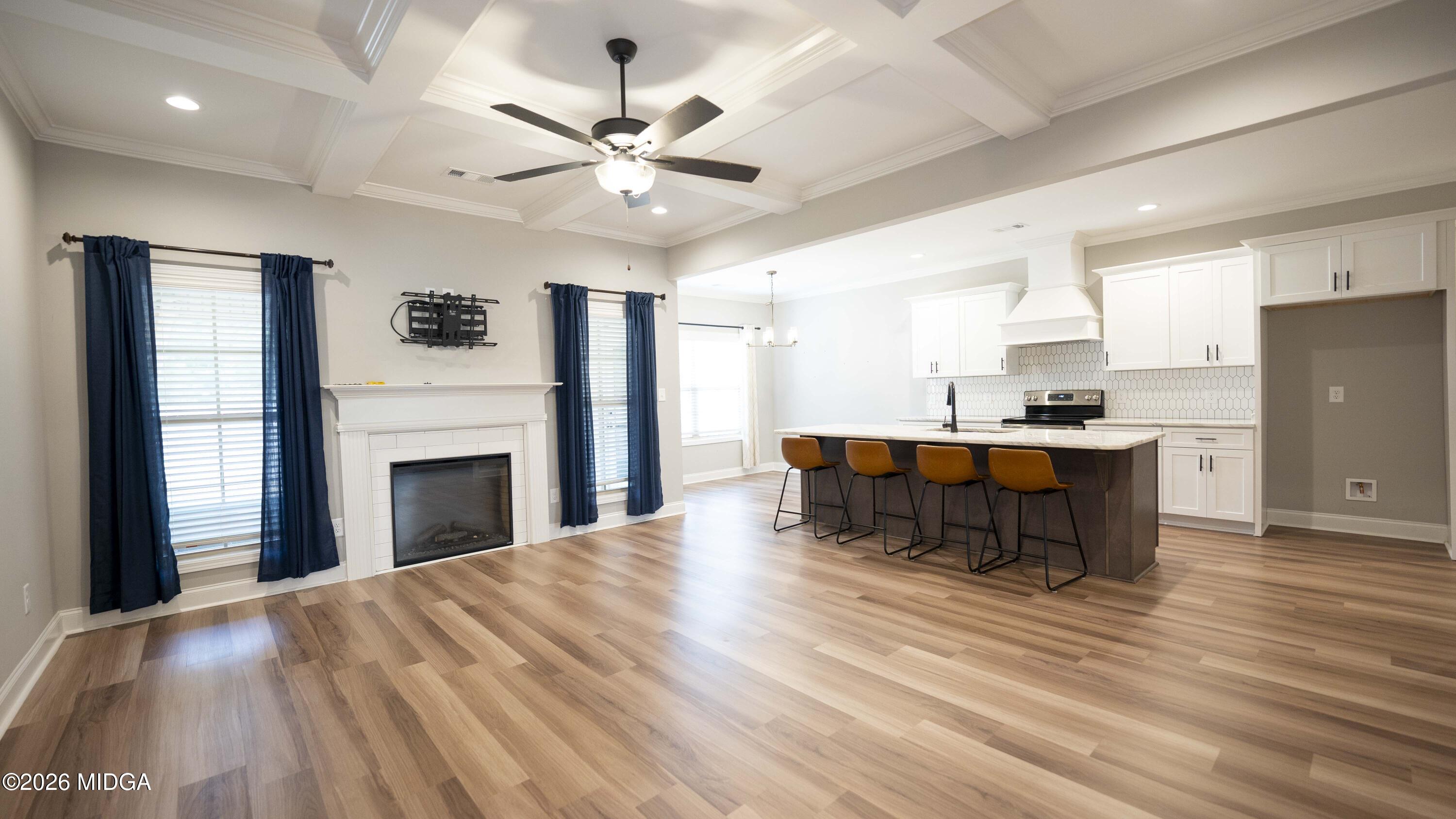 219 Otters Ridge Drive Kathleen, GA 31047 - Photo 13 of 44 a living room with stainless steel appliances kitchen island furniture and a fireplace
