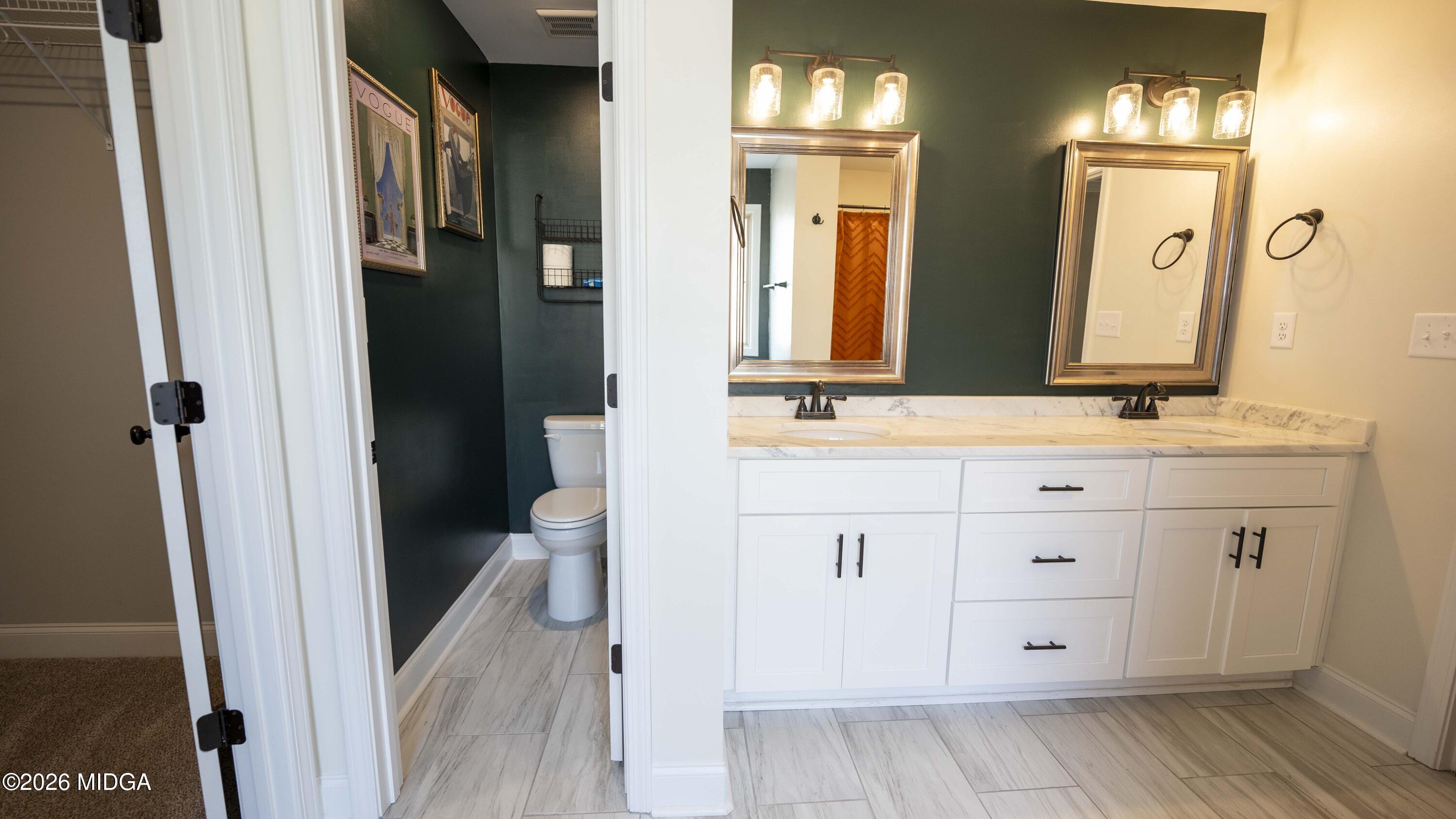 219 Otters Ridge Drive Kathleen, GA 31047 - Photo 25 of 44 a bathroom with a sink and a mirror