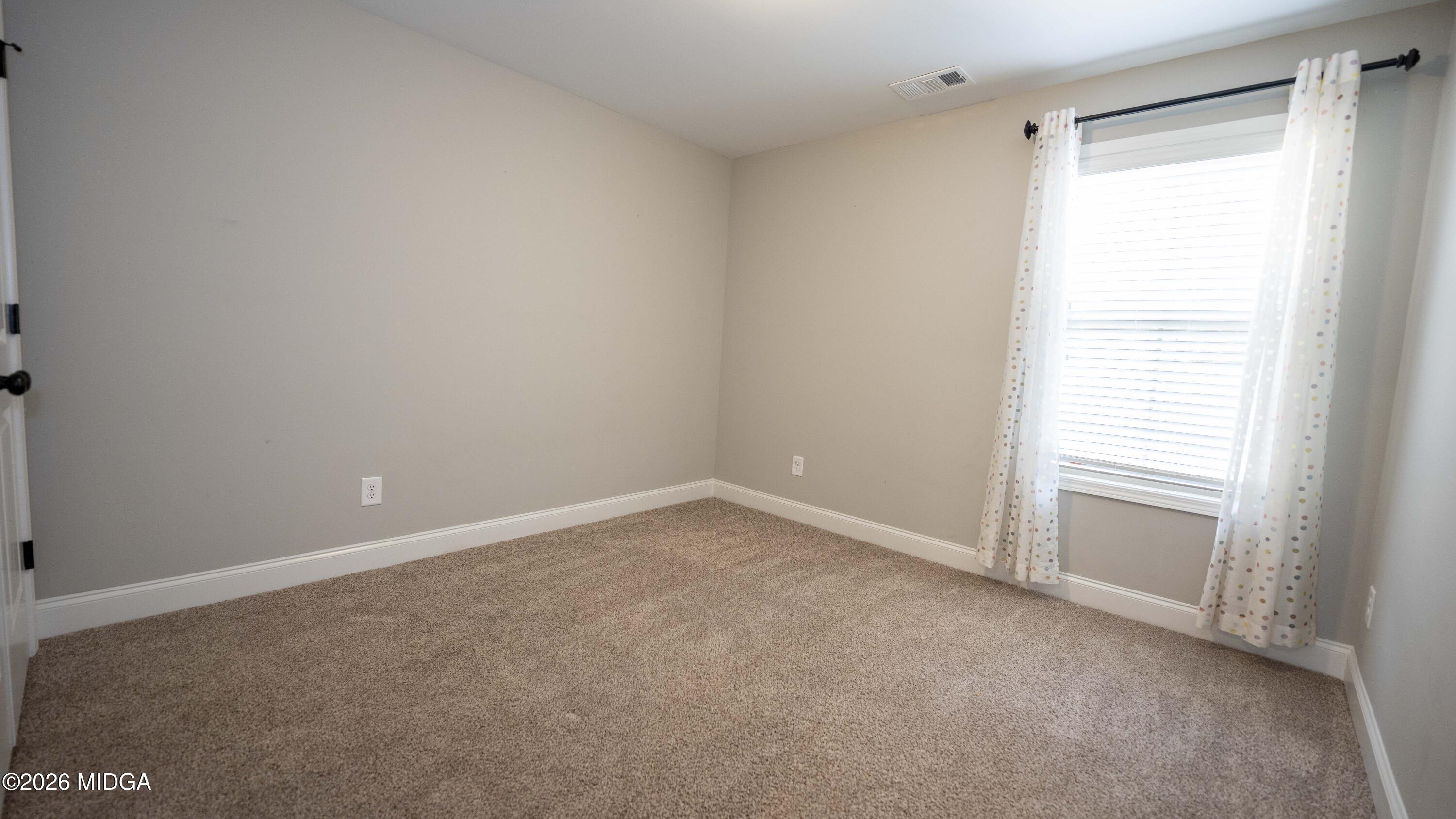 219 Otters Ridge Drive Kathleen, GA 31047 - Photo 28 of 44 a view of an empty room with a window