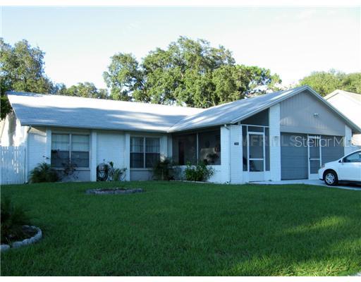 720 Granite Road Brandon, FL 33510 - Photo 1 of 1 a view of a house with a yard and sitting area