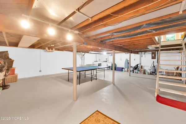 a view of a studio with wooden floor
