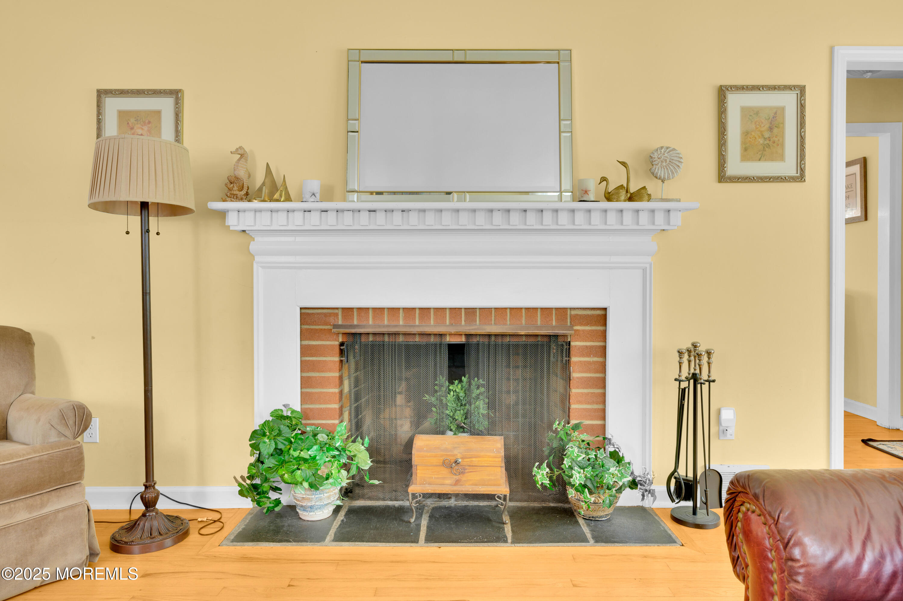 2203 3rd Avenue Spring Lake, NJ 07762 - Photo 4 of 27 a living room with furniture and a fireplace