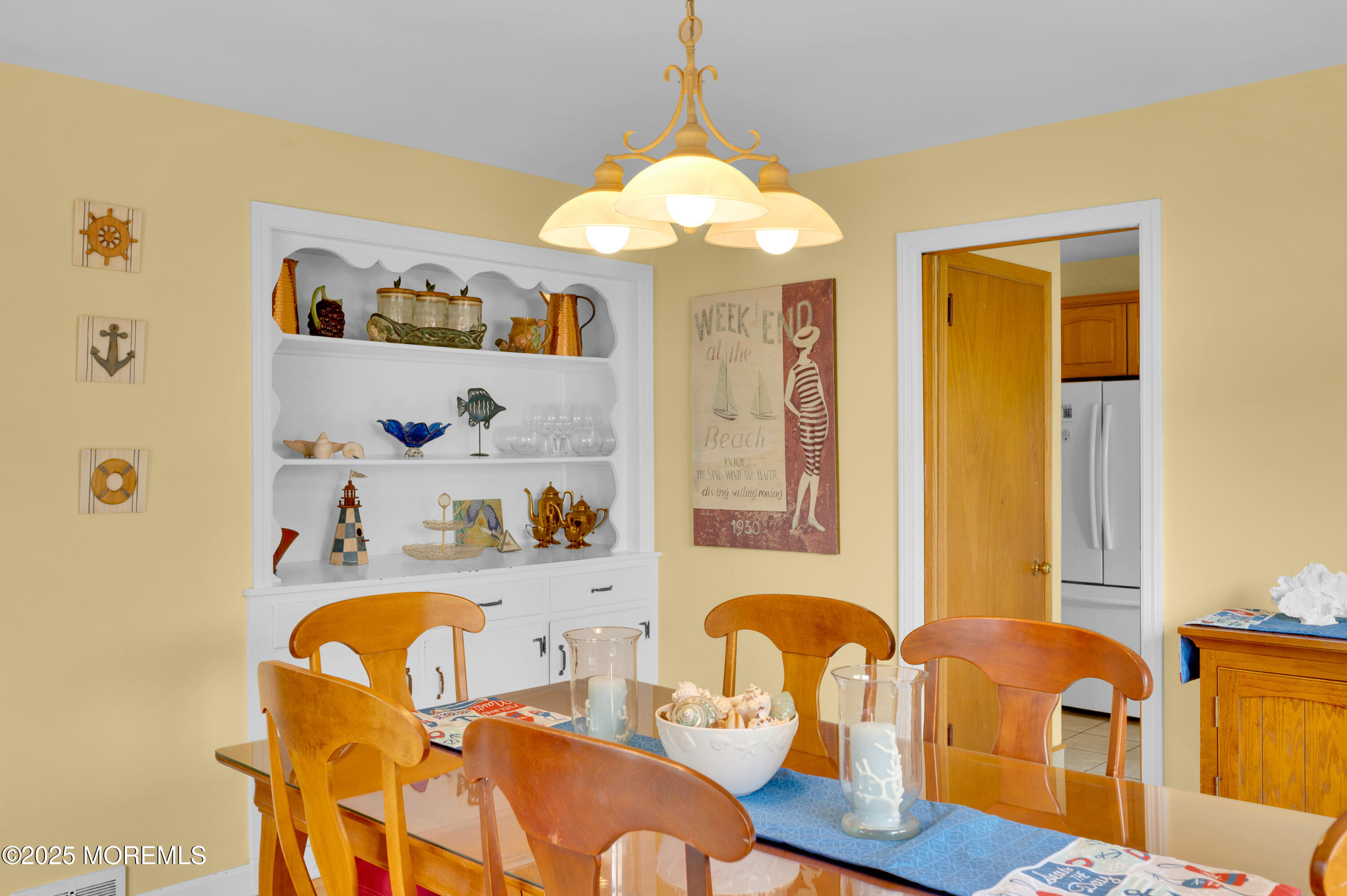2203 3rd Avenue Spring Lake, NJ 07762 - Photo 7 of 27 a dining room with furniture and chandelier