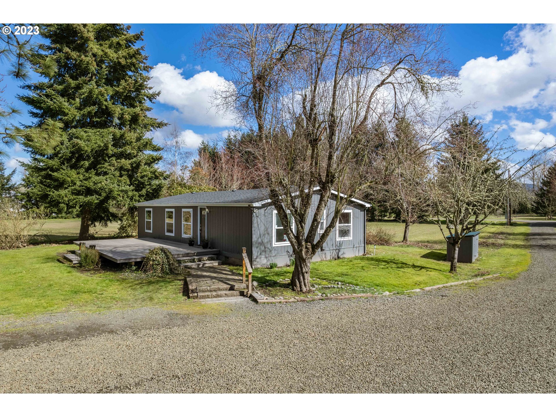 1625 River Loop 1 Eugene, OR 97404 - Photo 2 of 32 a view of a house with backyard and sitting area