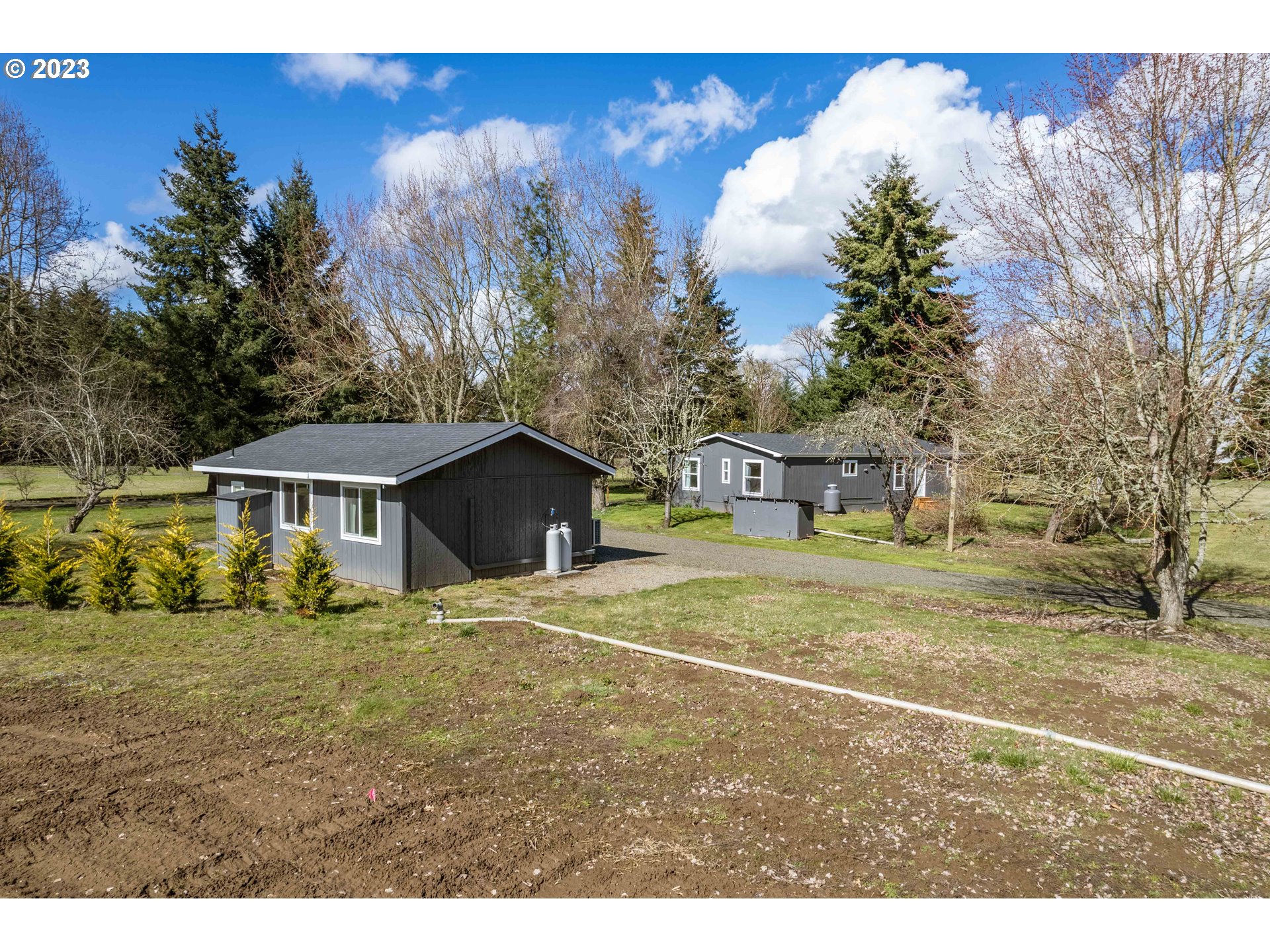 1625 River Loop 1 Eugene, OR 97404 - Photo 30 of 32 a view of a house with a yard