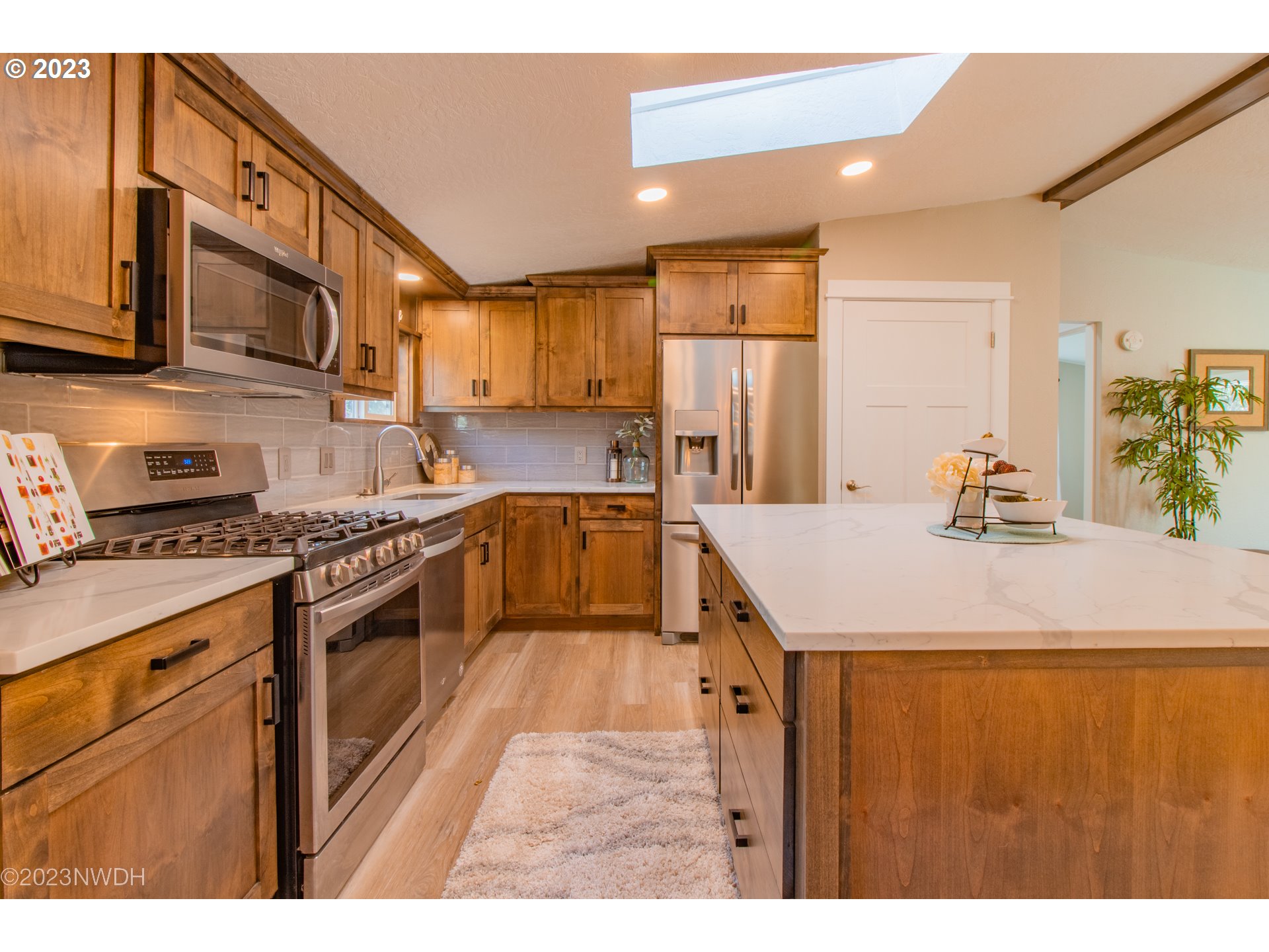 1625 River Loop 1 Eugene, OR 97404 - Photo 9 of 32 a kitchen with stainless steel appliances granite countertop a sink a stove and a refrigerator