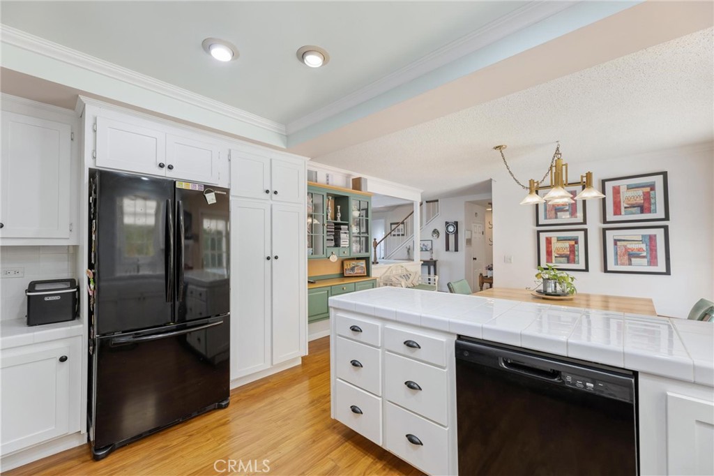 10800 Bismarck Avenue Porter Ranch, CA 91326 - Photo 13 of 29 a kitchen with stainless steel appliances a refrigerator and a stove