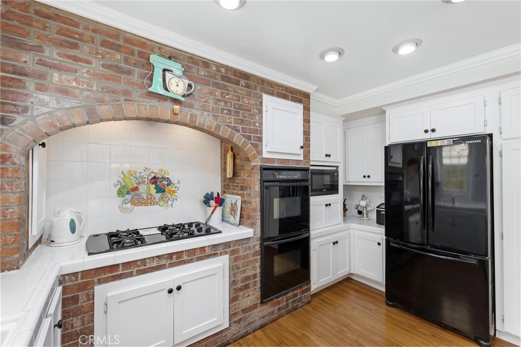 10800 Bismarck Avenue Porter Ranch, CA 91326 - Photo 14 of 29 a kitchen with a refrigerator and a stove