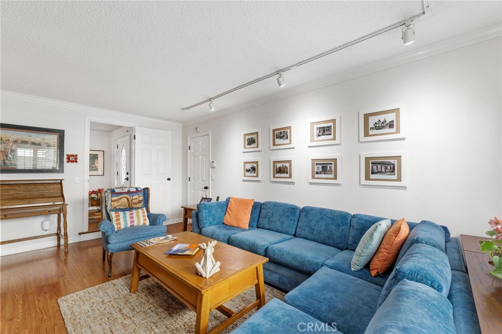 10800 Bismarck Avenue Porter Ranch, CA 91326 - Photo 17 of 29 a living room with furniture and wooden floor