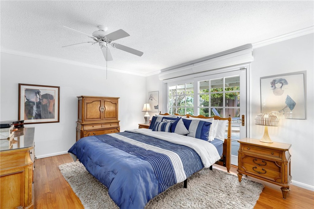 10800 Bismarck Avenue Porter Ranch, CA 91326 - Photo 18 of 29 a bedroom with a bed a couch and large window