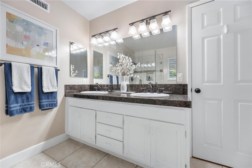 10800 Bismarck Avenue Porter Ranch, CA 91326 - Photo 21 of 29 a bathroom with a sink and a mirror