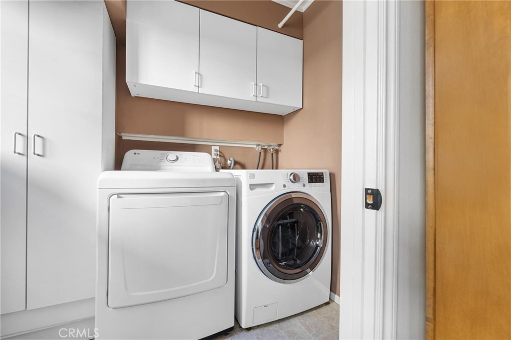 10800 Bismarck Avenue Porter Ranch, CA 91326 - Photo 25 of 29 a utility room with dryer and washer