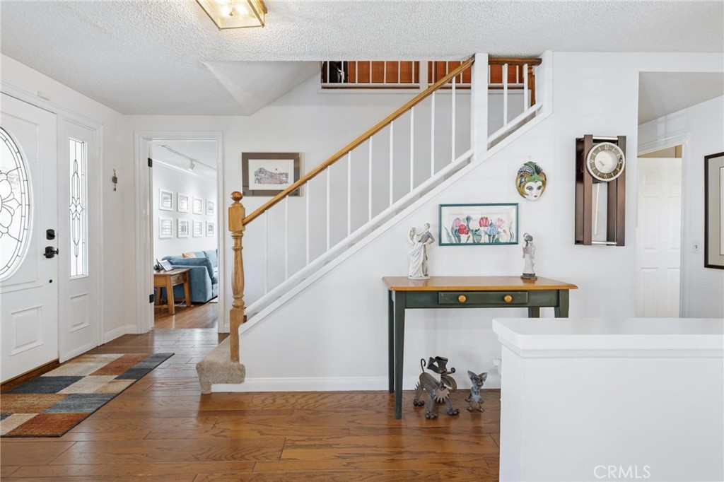 10800 Bismarck Avenue Porter Ranch, CA 91326 - Photo 6 of 29 a view of entryway and hall with wooden floor