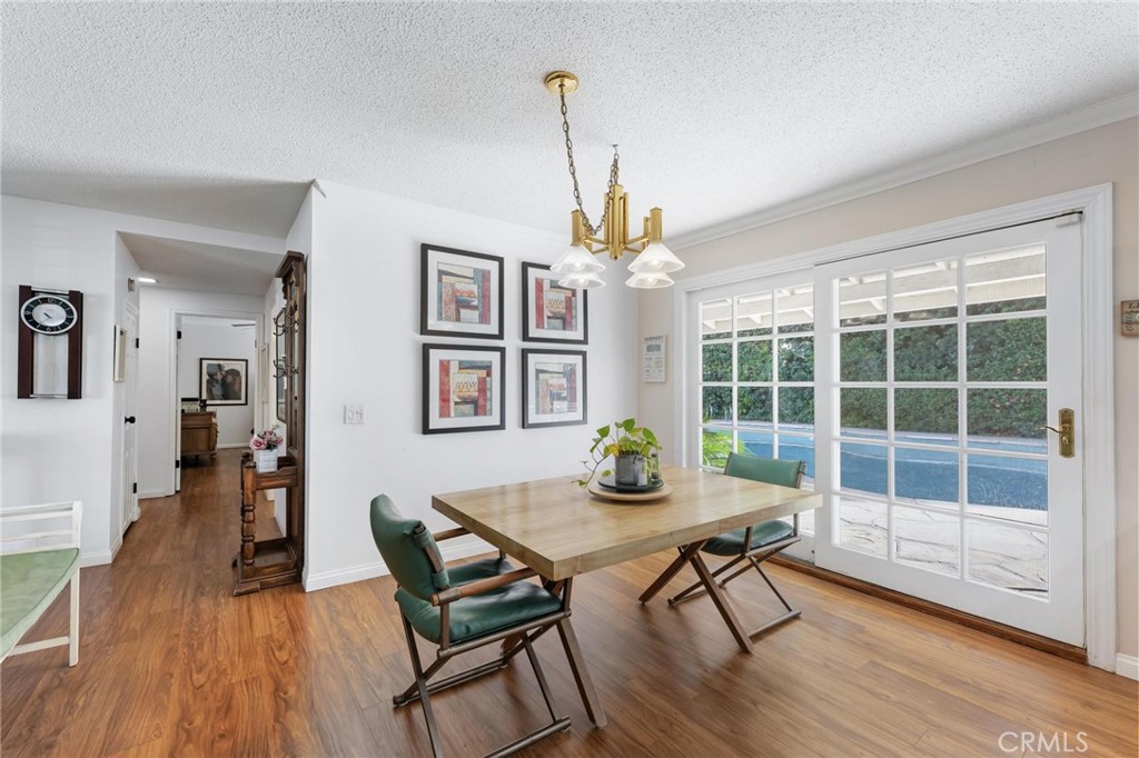 10800 Bismarck Avenue Porter Ranch, CA 91326 - Photo 9 of 29 a view of a dining room with furniture window and wooden floor