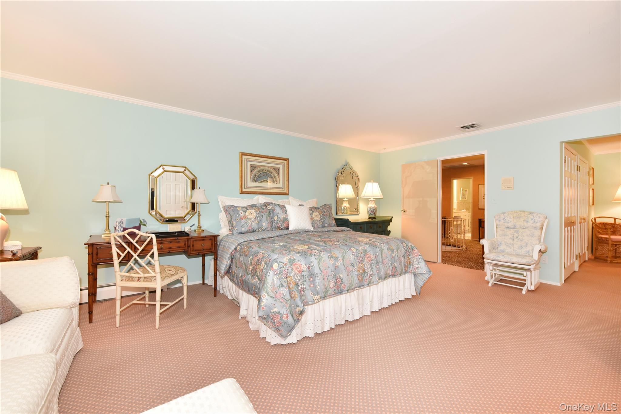 11 Joy Drive Manhasset Hills, NY 11040 - Photo 25 of 41 a spacious bedroom with a bed a table and chair