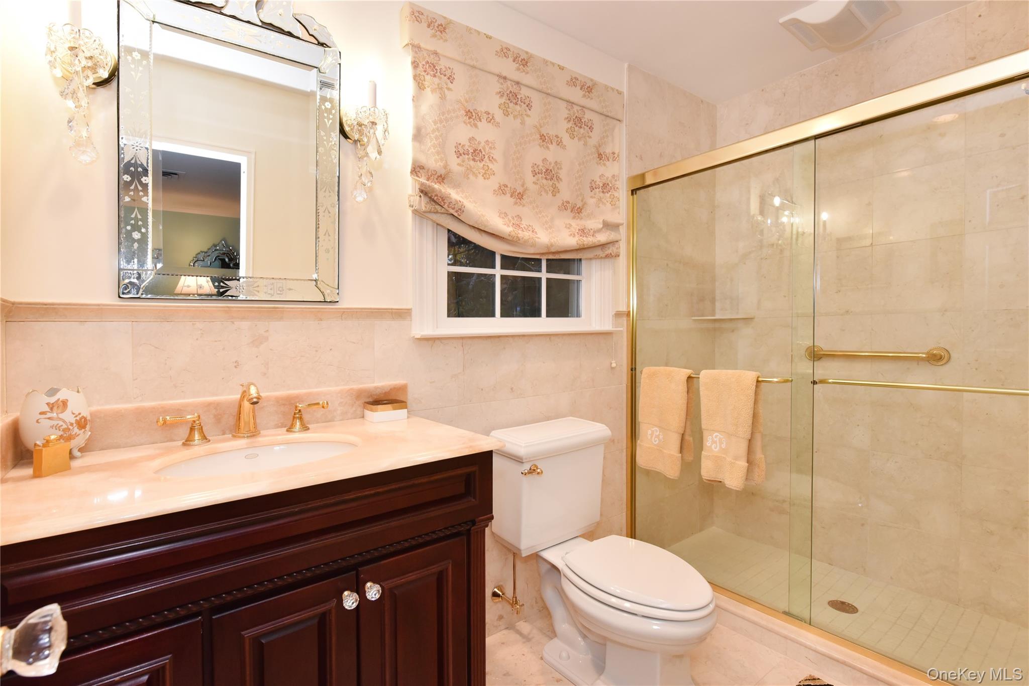 11 Joy Drive Manhasset Hills, NY 11040 - Photo 28 of 41 a bathroom with a sink a toilet and shower