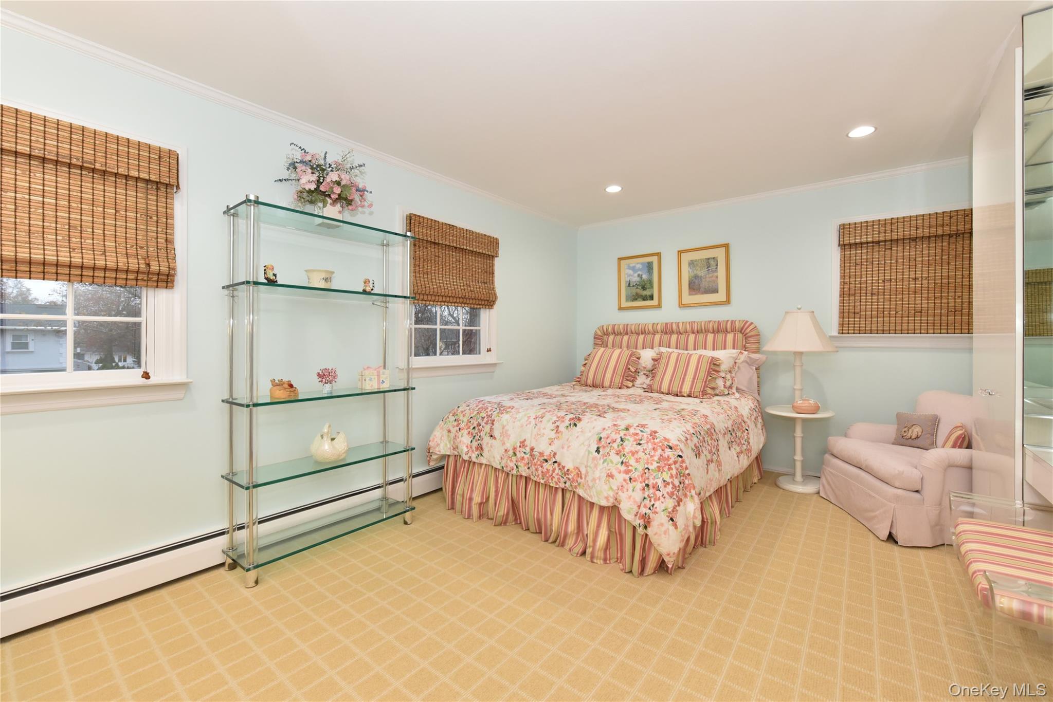 11 Joy Drive Manhasset Hills, NY 11040 - Photo 30 of 41 a bedroom with a bed dresser and window