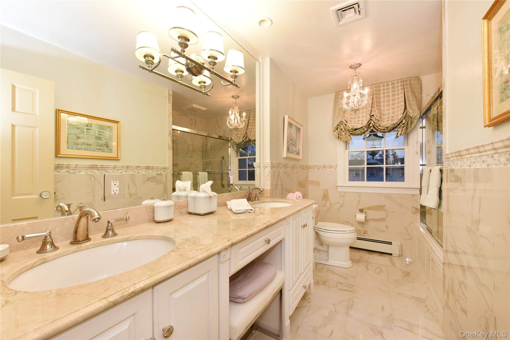 11 Joy Drive Manhasset Hills, NY 11040 - Photo 32 of 41 a bathroom with a double vanity sink mirror and toilet